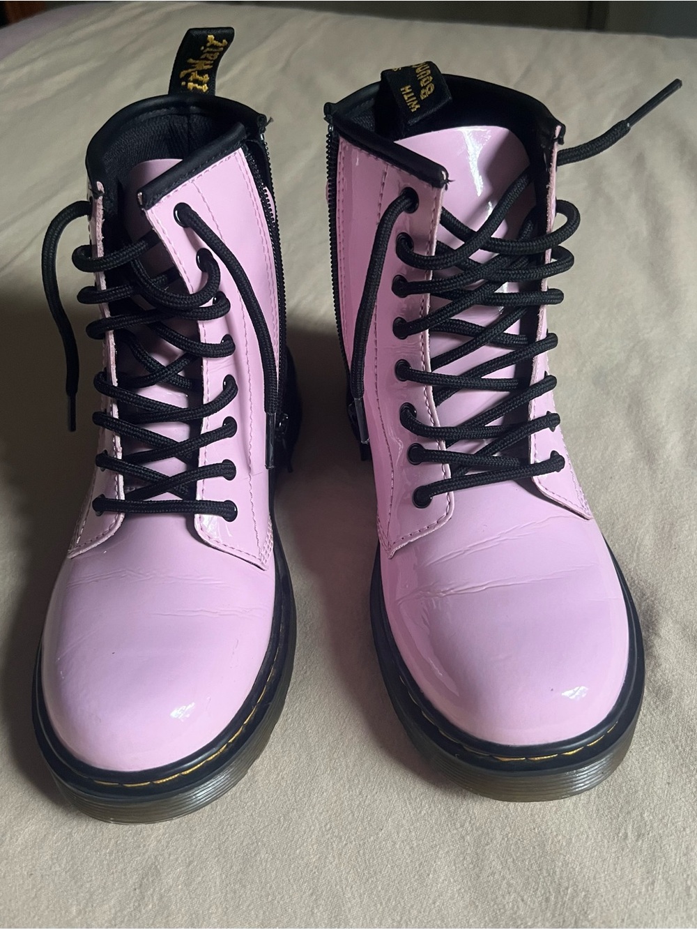 Dr. Martens Pink Patent Combat Boots with Black Laces